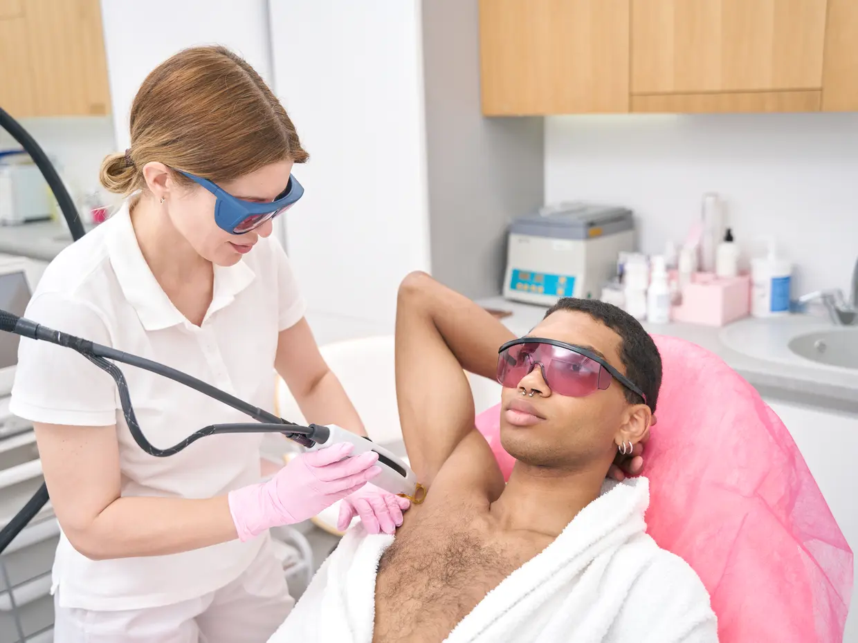 person receiving laser hair removal treatment